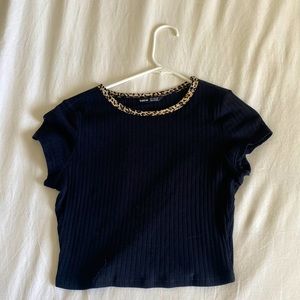 This is a black shirt, at the top there is cheetah print around the collar!!